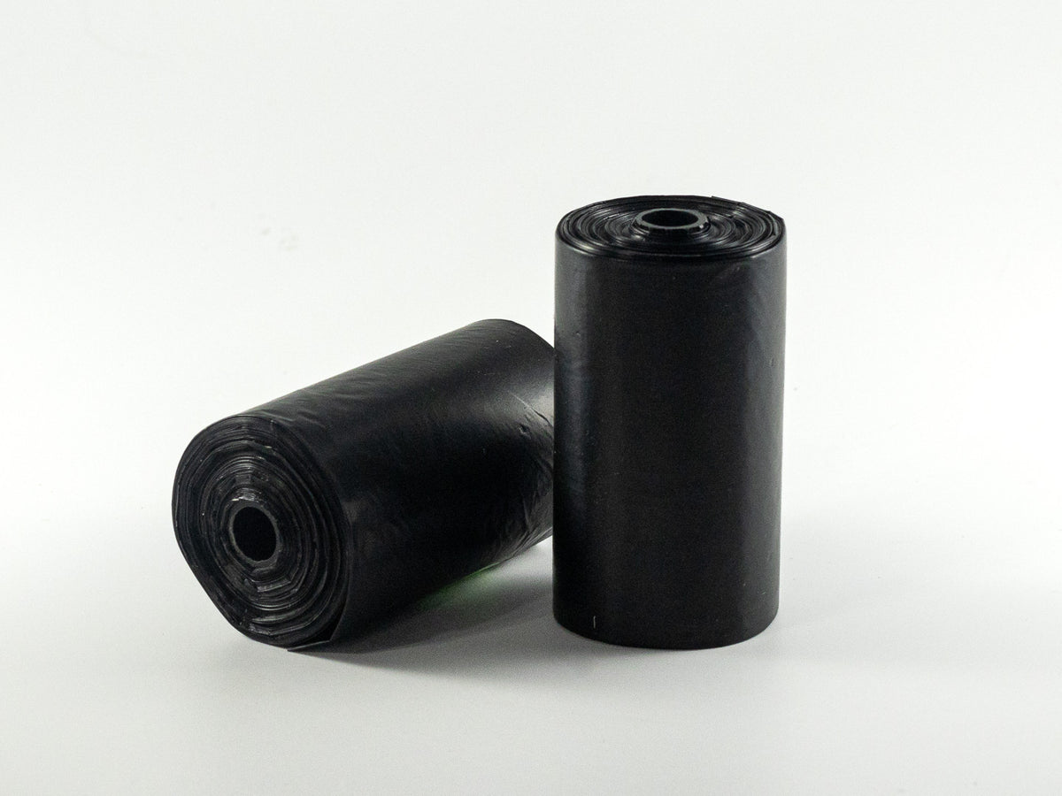 Black dog waste bag rolls included in The Irish Daisy Faithful Companion gift collection.