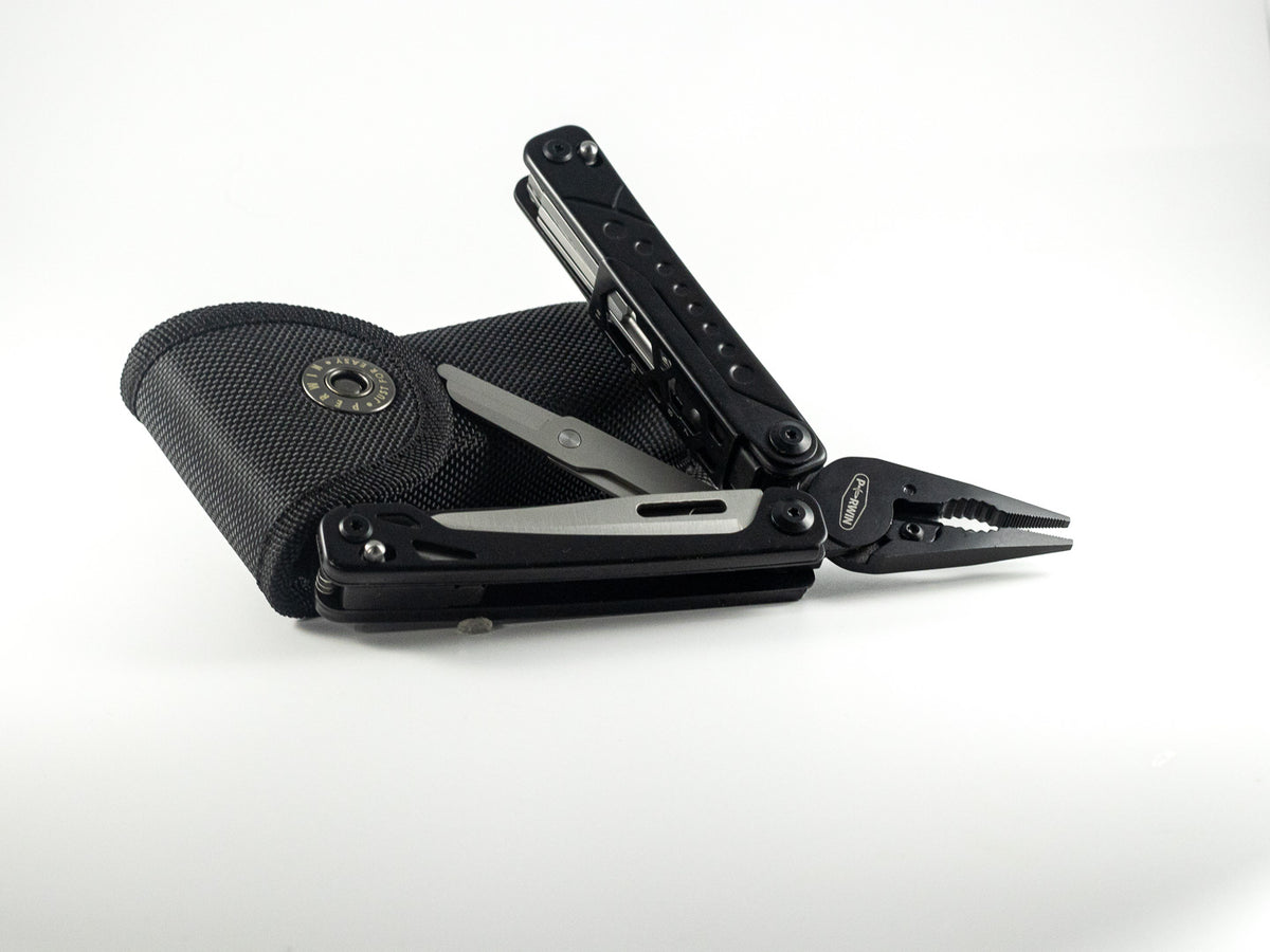 Black folding multitool with pliers, scissors, and carrying case for The Irish Daisy Heritage Weekender gift.