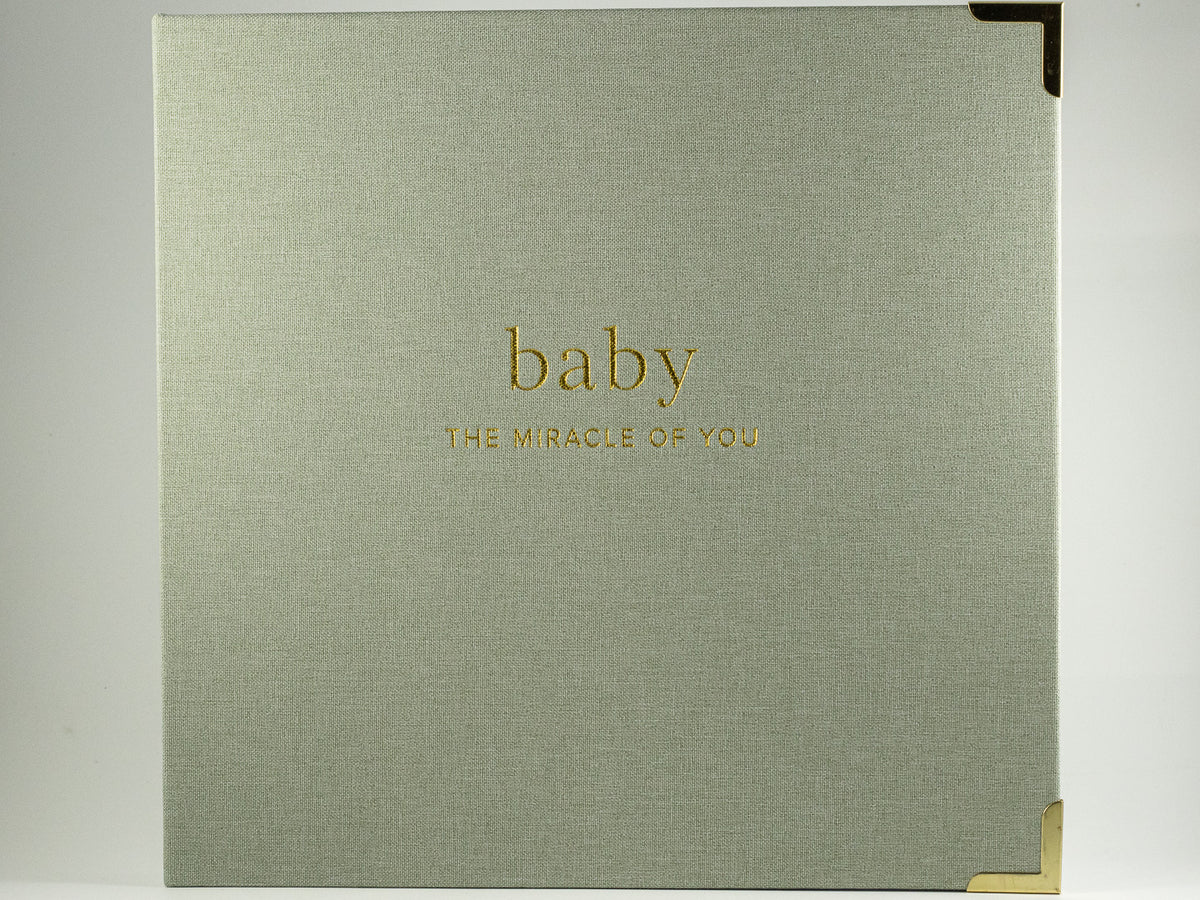 Sage linen baby memory book with gold lettering and corner details for The Irish Daisy Mama & Me gift.